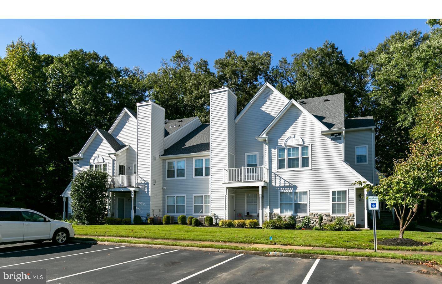 705 Quail Road Marlton, NJ 08053 - Photo 2 of 13 a view of a white house next to a yard with big trees