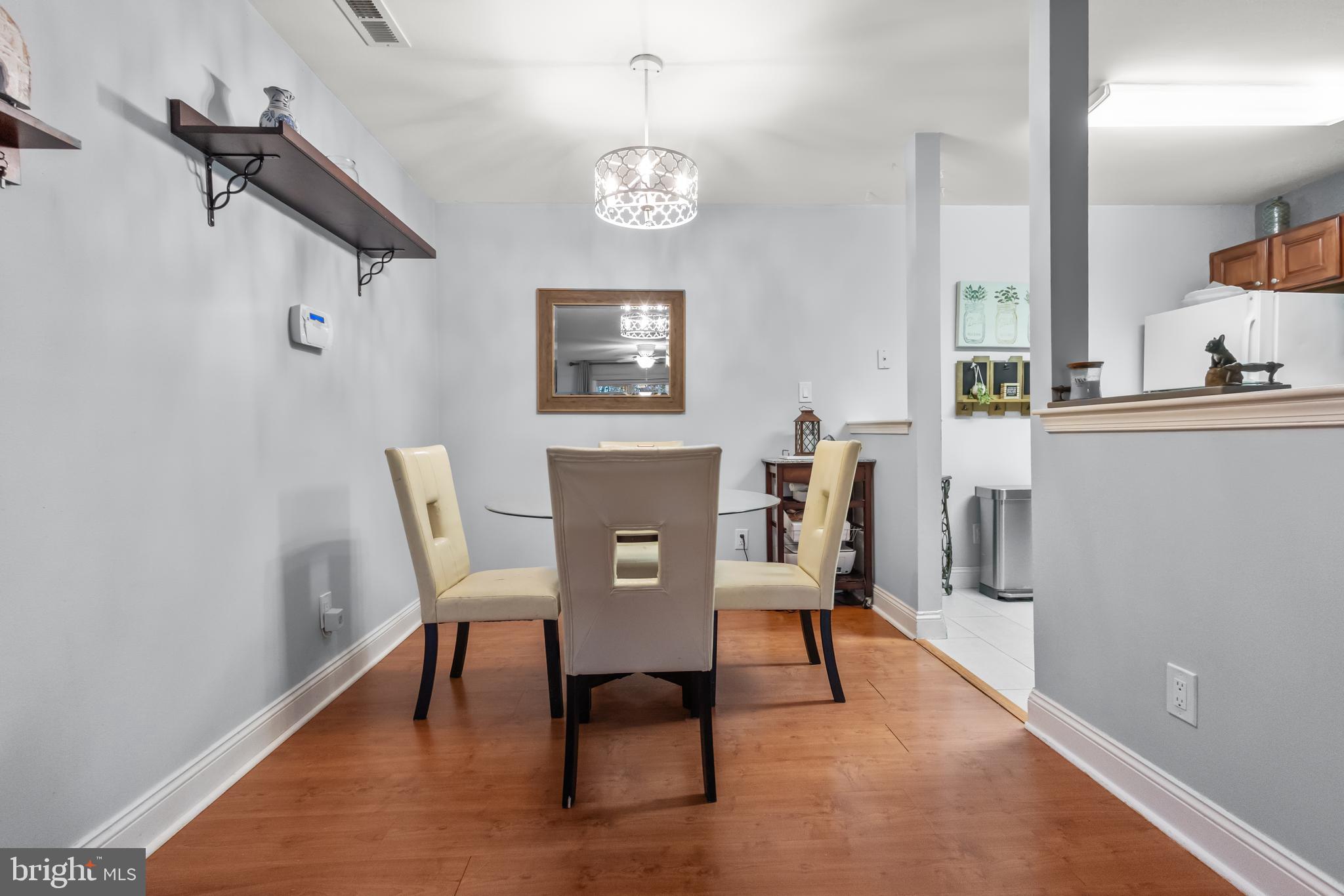 705 Quail Road Marlton, NJ 08053 - Photo 6 of 13 a view of a dining room with furniture and wooden floor