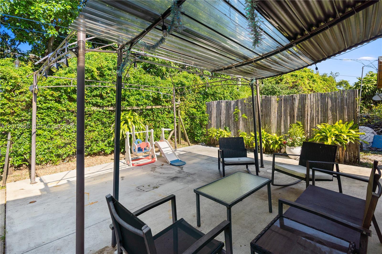 5300 Northwest 30th Place Miami, FL 33142 - Photo 26 of 35 a view of a backyard with sitting area