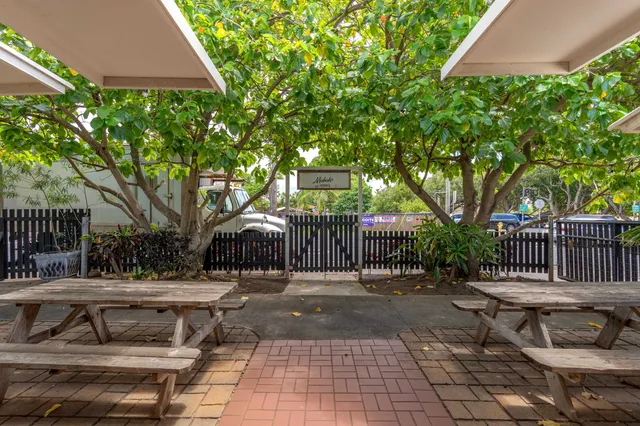 a view of a patio with table and chairs and potted plants