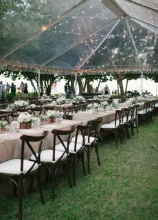 a view of a big yard with table and chairs