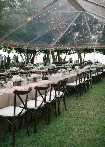 a view of a big yard with table and chairs