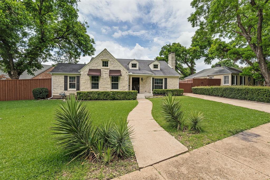 2006 Marydale Road Dallas, TX 75208 - Photo 4 of 40 Stone exterior residence featuring a gabled roofline and dormer windows