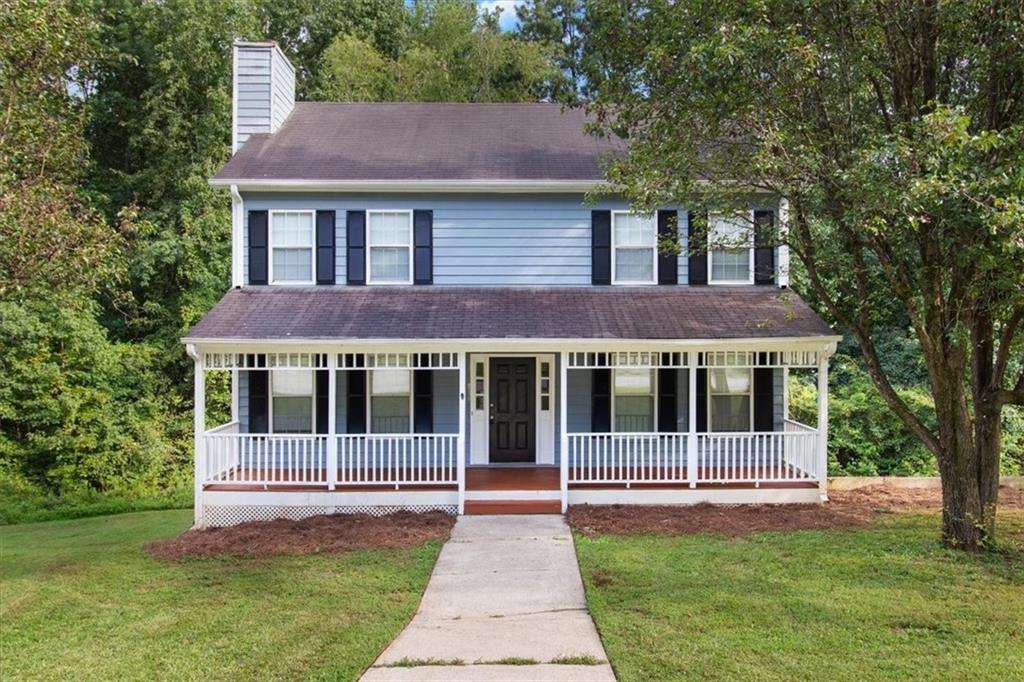 4107 Springridge Court Powder Springs, GA 30127 - Photo 1 of 1 a view of house with yard and large tree