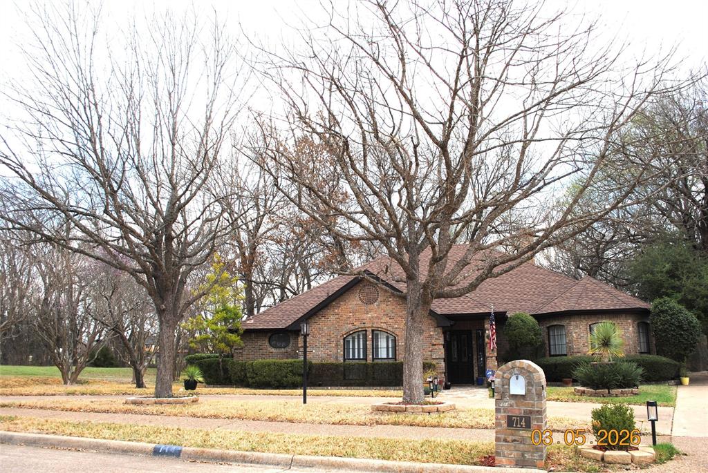 TRue custom has circle drive plus drive to a 3 car garage on teh side.