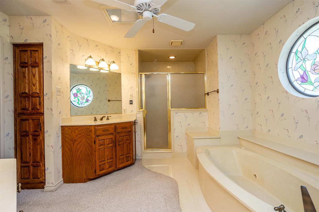 714 Mill Creek Road Lancaster, TX 75146 - Photo 16 of 27 Master has seprate shower with lots o storage available. Ceiling fan too.