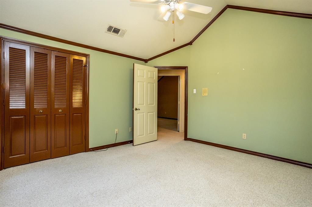 714 Mill Creek Road Lancaster, TX 75146 - Photo 18 of 27 Front bedroom showing closet and and door to hall.