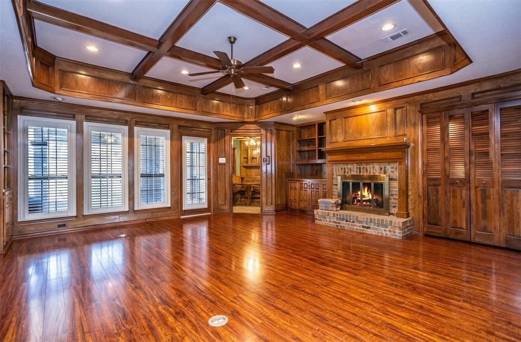 714 Mill Creek Road Lancaster, TX 75146 - Photo 4 of 27 Living has hardwood floors, fireplace with gas starter, plantation shutters, special ceiling treatments, wet bar.