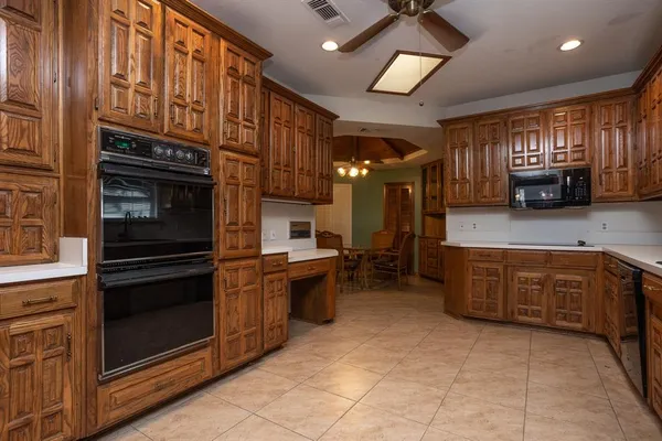 a kitchen with stainless steel appliances granite countertop a stove and a sink