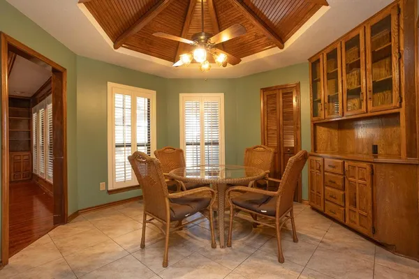 a view of a dining room with furniture and window