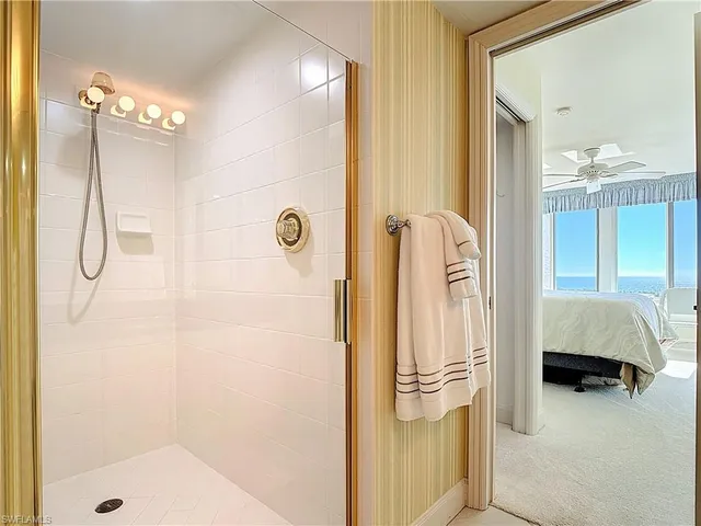 a bathroom with a tub and shower