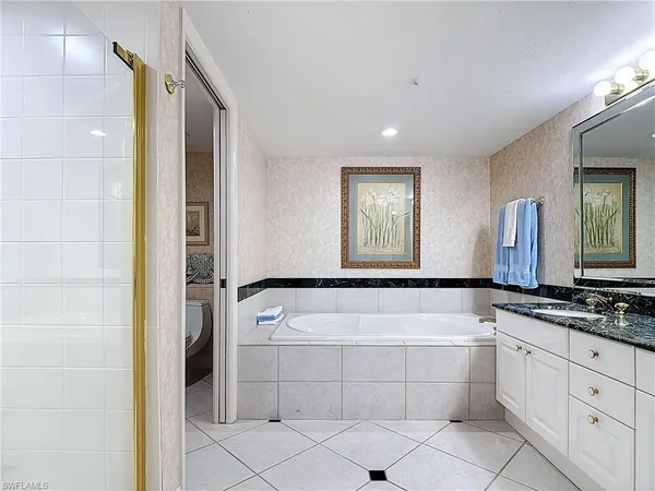 a bathroom with a bathtub and a sink
