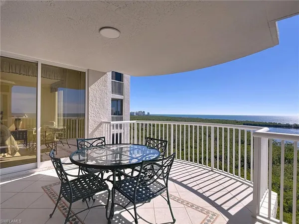 a view of a patio with a table and chairs