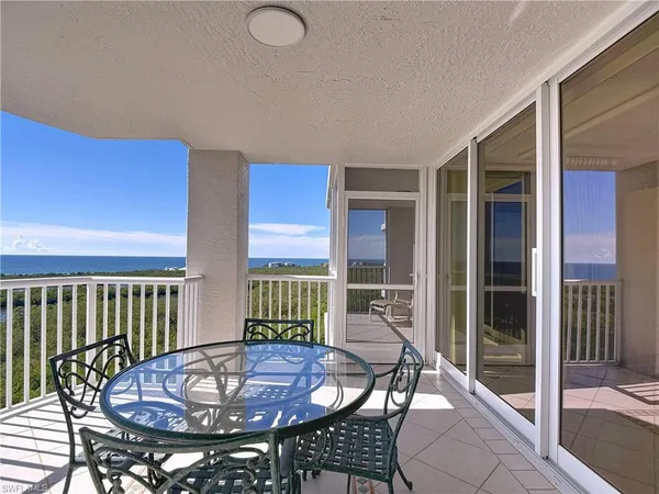 a view of balcony with furniture