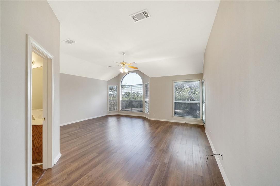 11901 Jess Drive Austin, TX 78737 - Photo 14 of 36 wooden floor in an empty room with a window