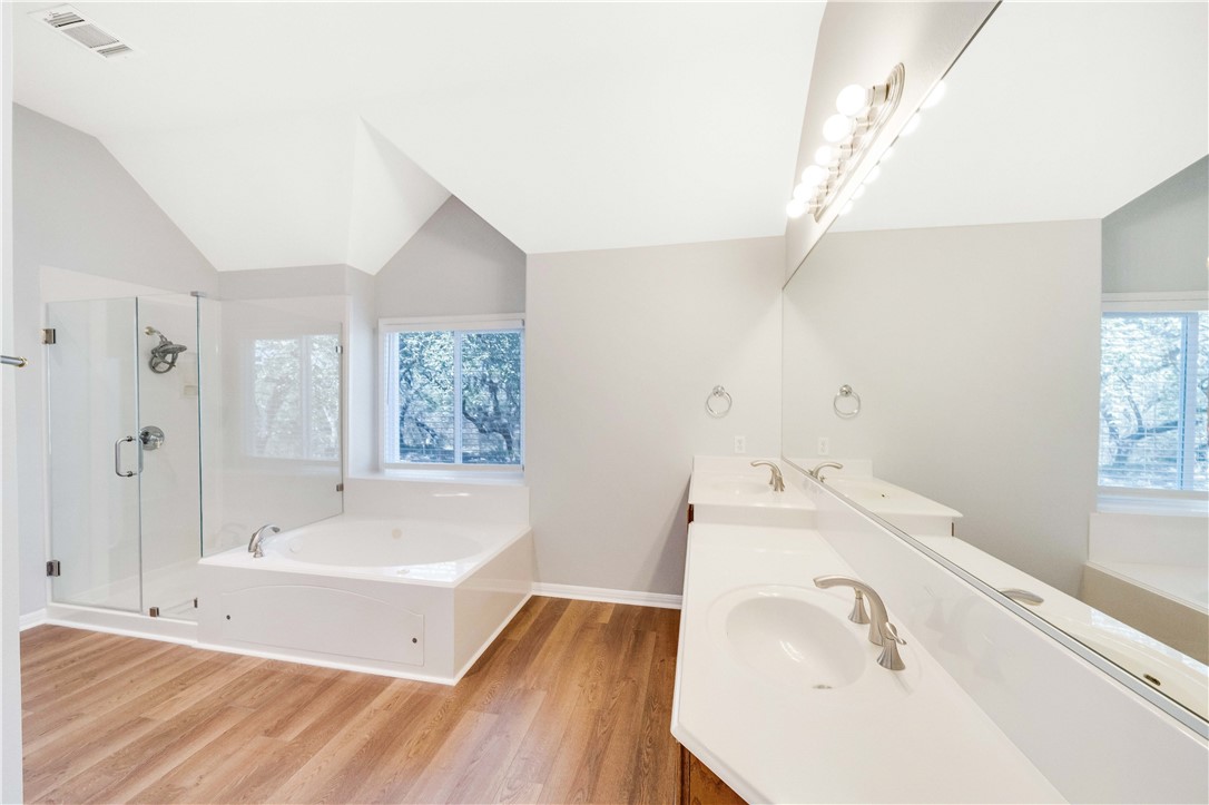 11901 Jess Drive Austin, TX 78737 - Photo 16 of 36 a bathroom with a tub sink and mirror