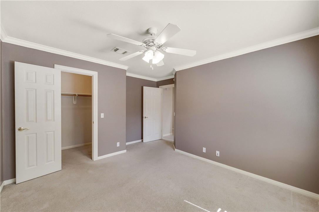 11901 Jess Drive Austin, TX 78737 - Photo 24 of 36 a view of an empty room with a ceiling fan