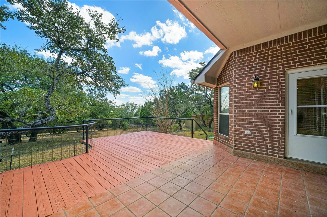 11901 Jess Drive Austin, TX 78737 - Photo 34 of 36 a backyard of a house with lots of green space