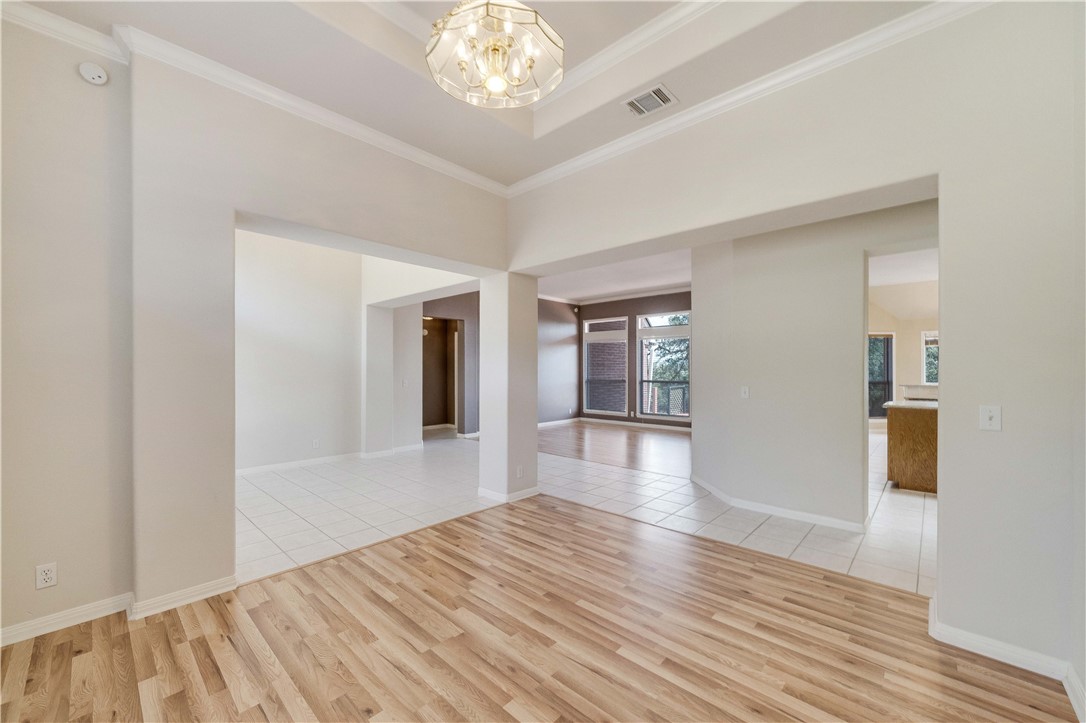 11901 Jess Drive Austin, TX 78737 - Photo 8 of 36 a view of an empty room with wooden floor