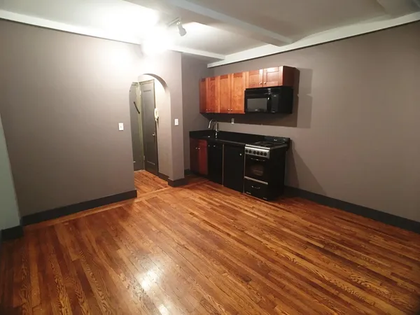 a view of a livingroom with wooden floor