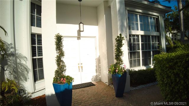 a house with a potted plant in front of it