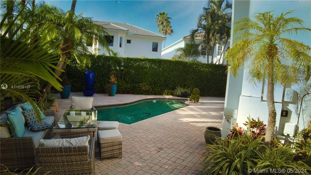a view of a patio with a yard