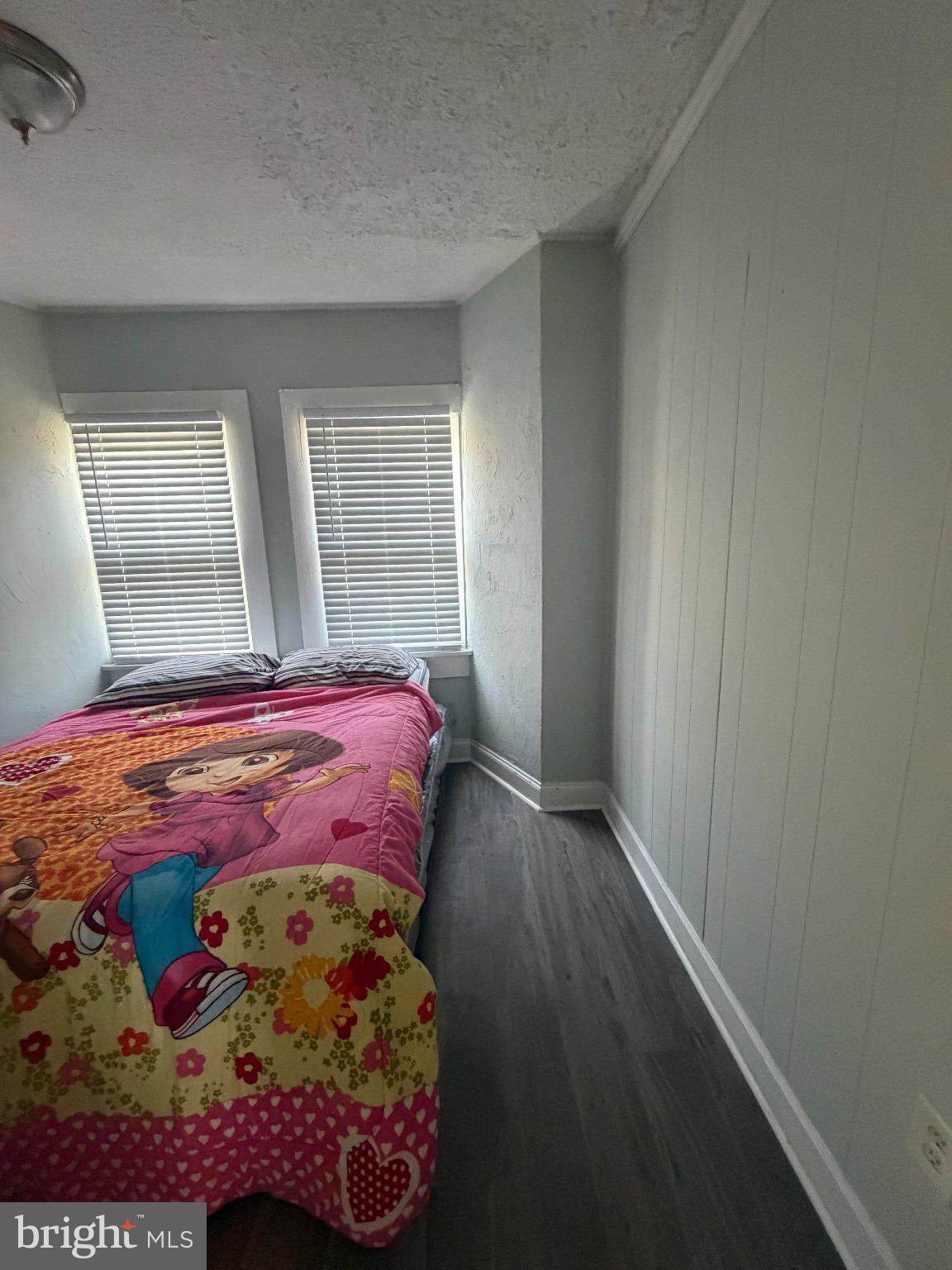 1114 North Mallory Street Hampton, VA 23663 - Photo 2 of 9 a bedroom with a bed and a window