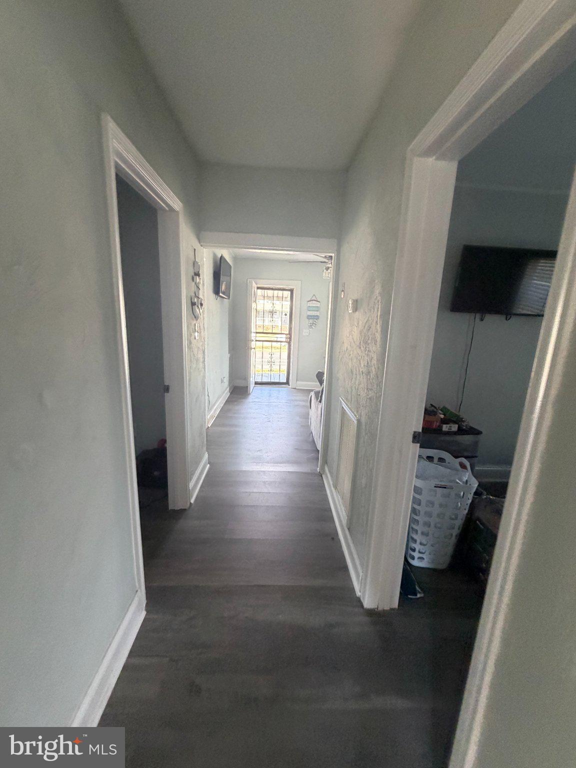 1114 North Mallory Street Hampton, VA 23663 - Photo 5 of 9 a view of a hallway with wooden floor and stairs