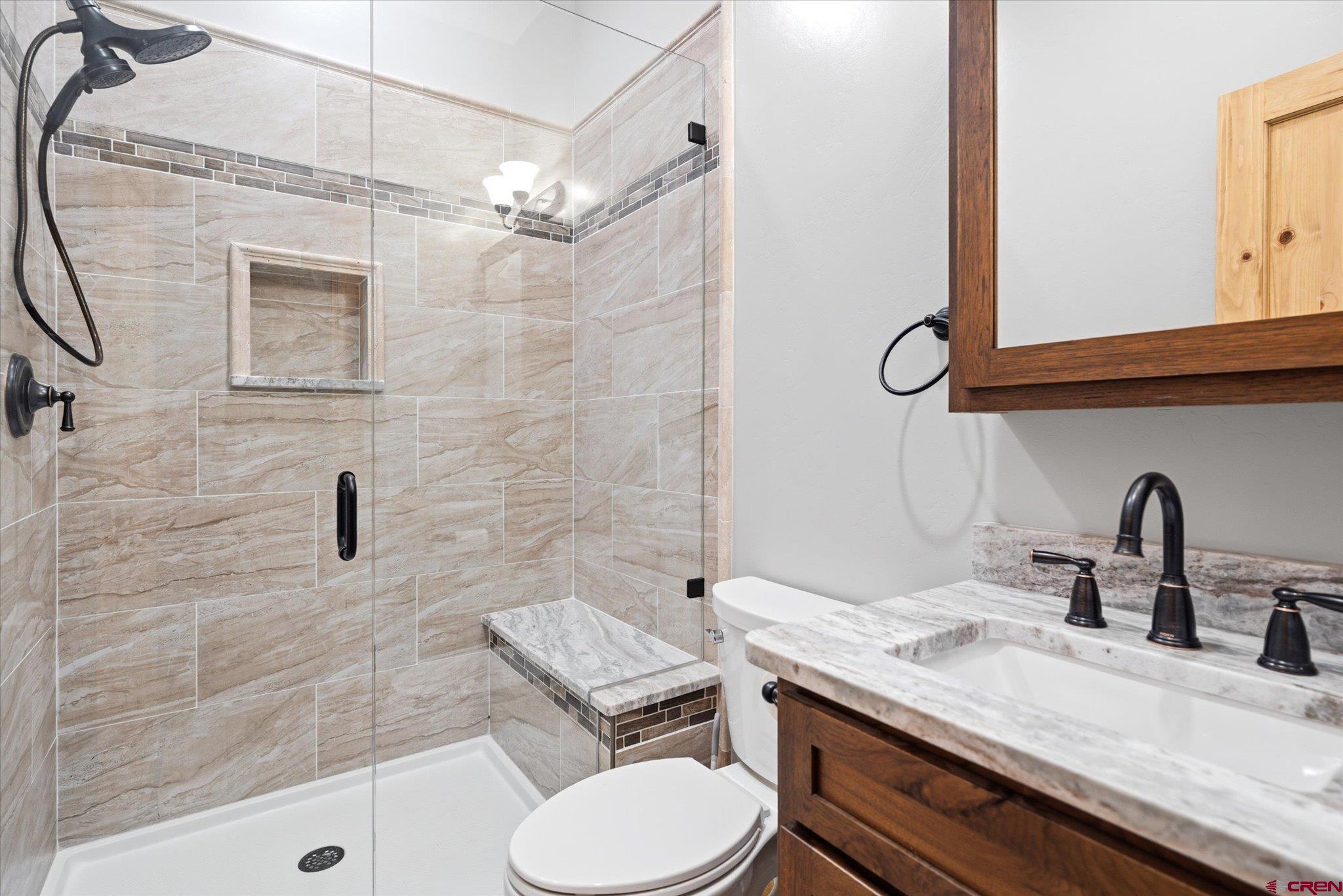 197 Hummingbird Way Bayfield, CO 81122 - Photo 36 of 44 a bathroom with a sink a toilet and shower
