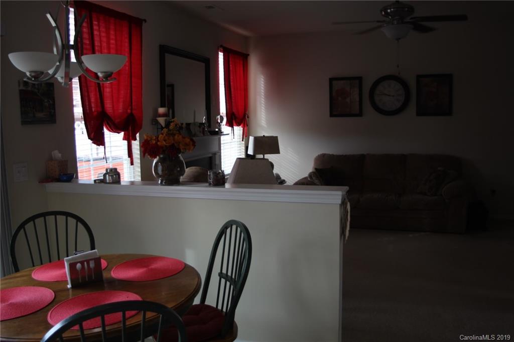 7539 Bluff Point Lane Denver, NC 28037 - Photo 13 of 30 a kitchen with a table chairs and a dining table