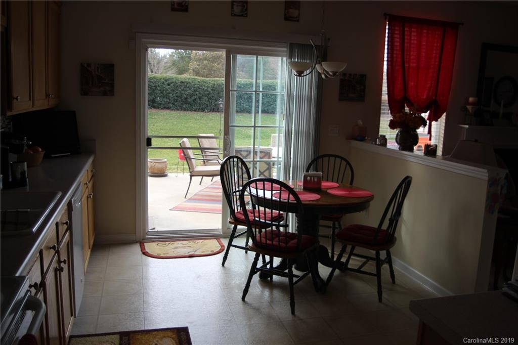 7539 Bluff Point Lane Denver, NC 28037 - Photo 14 of 30 a view of a dining room with furniture window and outside view