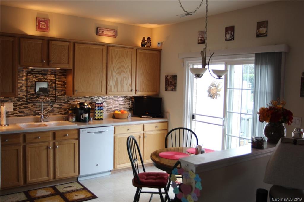 7539 Bluff Point Lane Denver, NC 28037 - Photo 17 of 30 a kitchen with stainless steel appliances granite countertop a refrigerator and a stove top oven