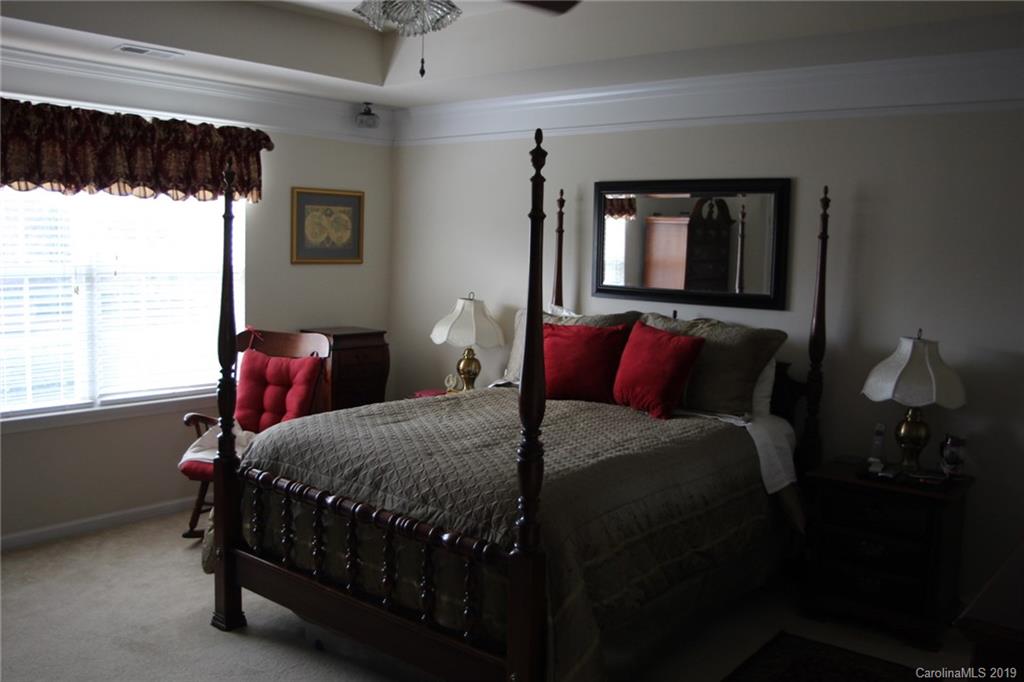 7539 Bluff Point Lane Denver, NC 28037 - Photo 18 of 30 a bedroom with bed and window