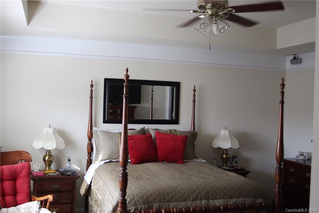 7539 Bluff Point Lane Denver, NC 28037 - Photo 19 of 30 a bedroom with a bed and window