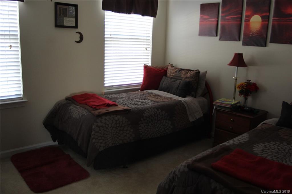 7539 Bluff Point Lane Denver, NC 28037 - Photo 24 of 30 a bedroom with a bed and window