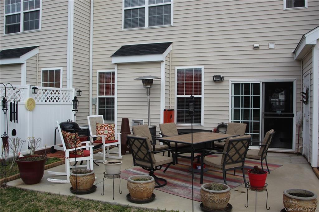 7539 Bluff Point Lane Denver, NC 28037 - Photo 26 of 30 a view of a dinning tables and chairs in the patio