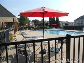 7539 Bluff Point Lane Denver, NC 28037 - Photo 28 of 30 an outdoor view of patio with chairs and umbrella