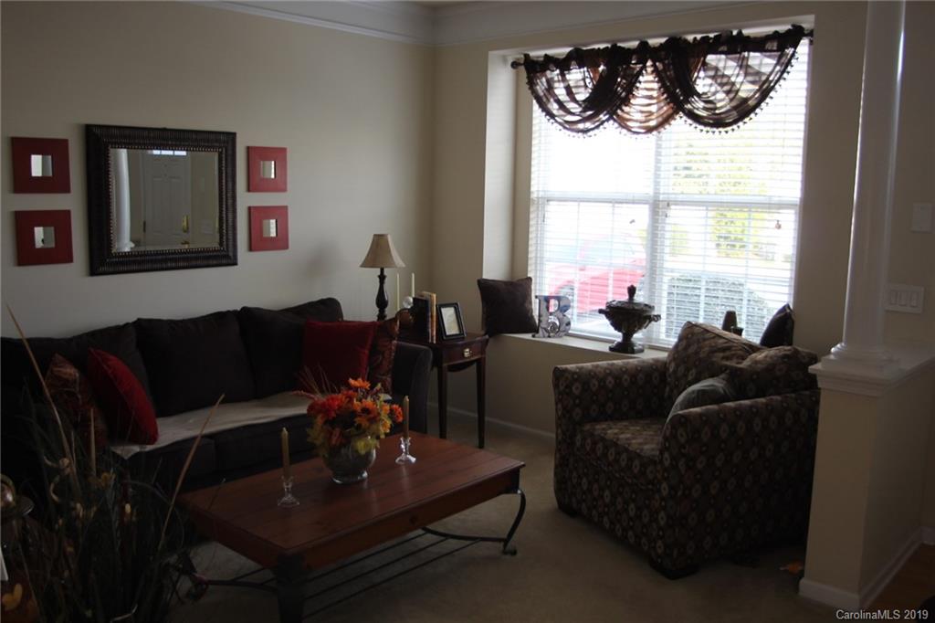 7539 Bluff Point Lane Denver, NC 28037 - Photo 5 of 30 a living room with furniture and a large window