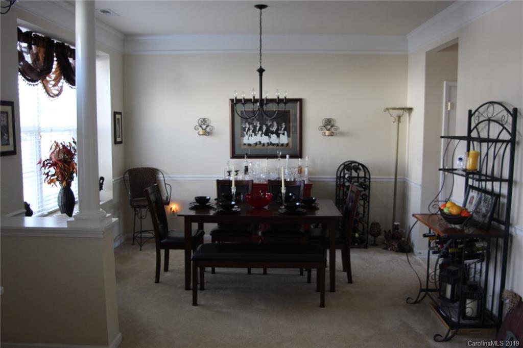 7539 Bluff Point Lane Denver, NC 28037 - Photo 7 of 30 a view of a dining room with furniture and chandelier