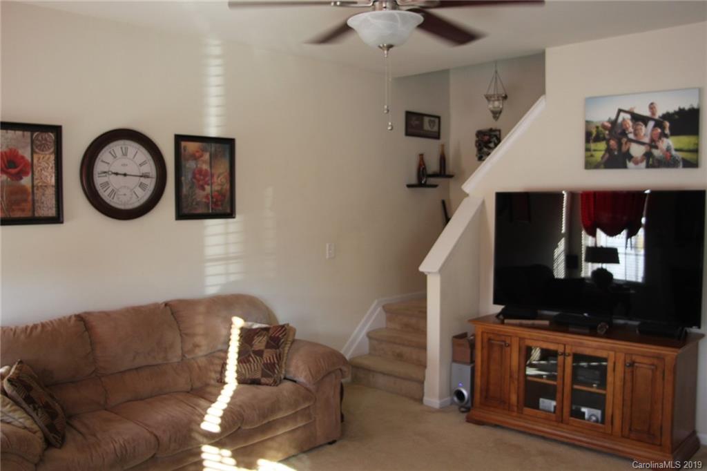 7539 Bluff Point Lane Denver, NC 28037 - Photo 10 of 30 a living room with furniture and a flat screen tv