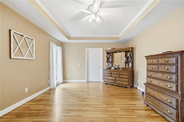a view of walk in closet with clothes
