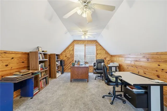 a living room with furniture a rug and a window