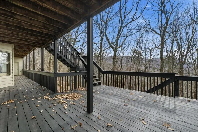 a view of a balcony with wooden floor