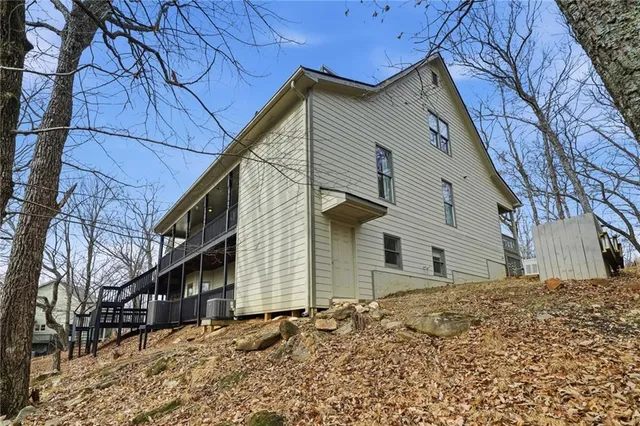 a aerial view of a house with a yard