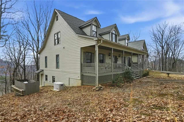 a view of a swimming pool with a garden and trees