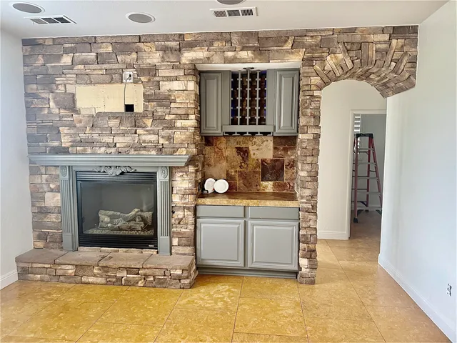 a kitchen with stainless steel appliances granite countertop a stove and a refrigerator