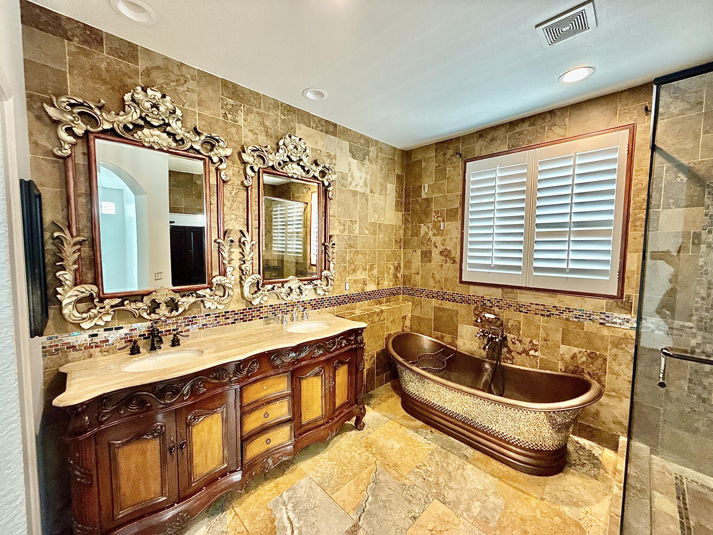 82546 Tivoli Court Indio, CA 92203 - Photo 15 of 19 a bathroom with a tub sink and mirror