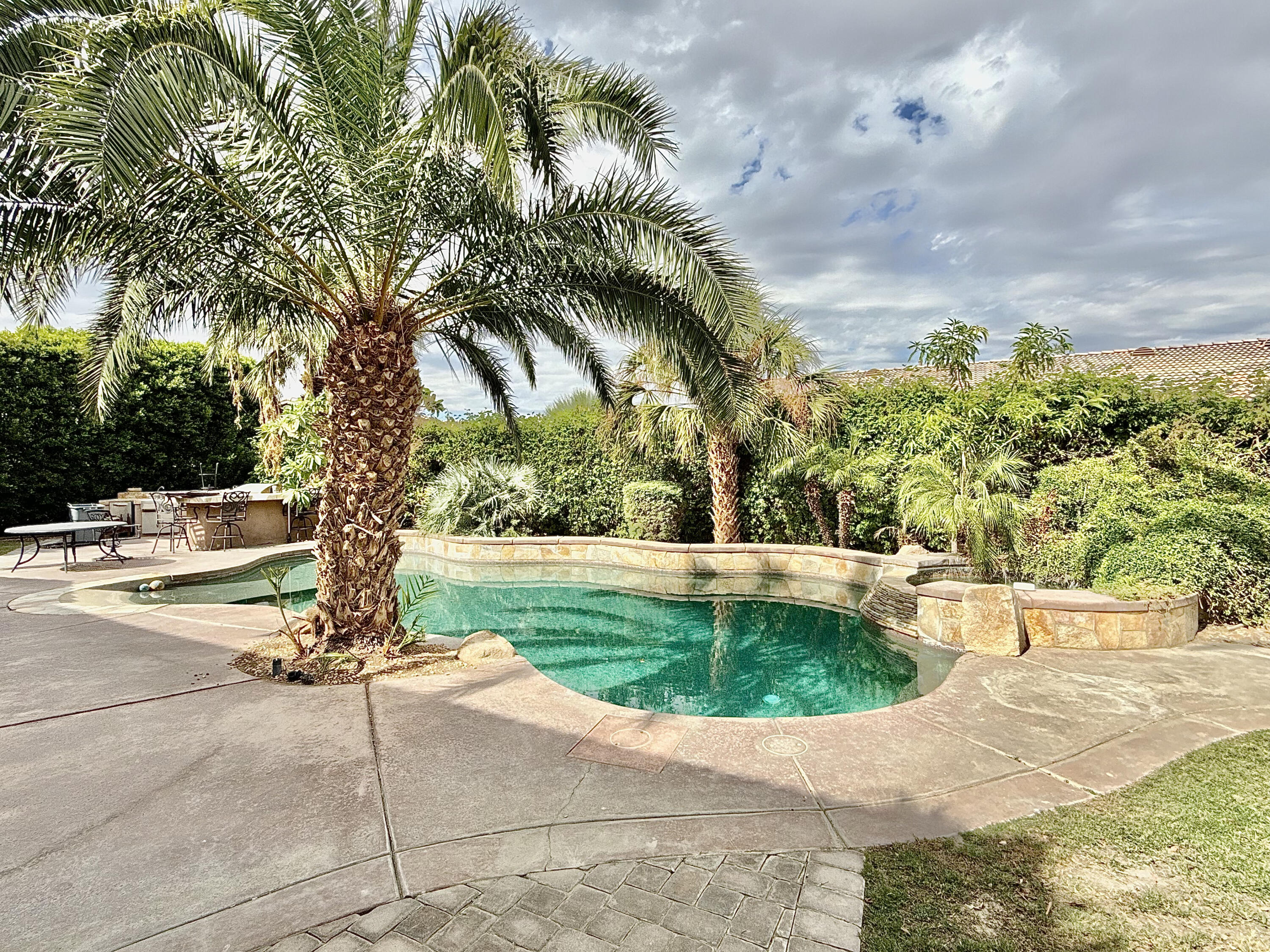 82546 Tivoli Court Indio, CA 92203 - Photo 19 of 19 a view of a swimming pool with a sitting area