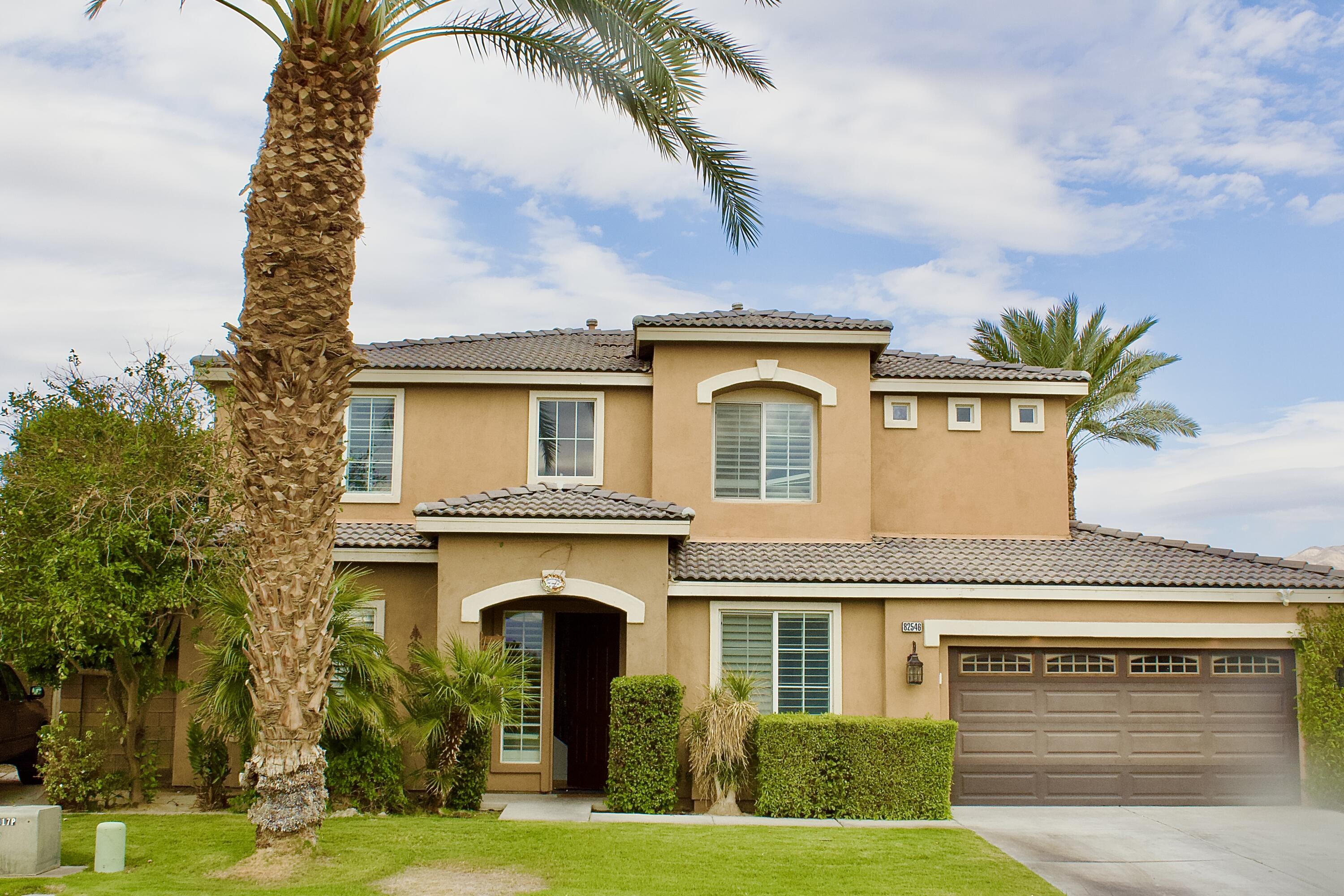 82546 Tivoli Court Indio, CA 92203 - Photo 2 of 19 a front view of a house with garden