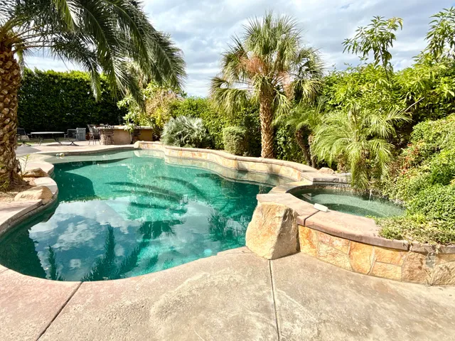 a view of yard with swimming pool